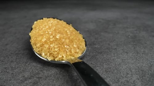 Close Up of Spoon Filled with Brown Sugar
