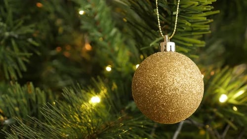 Glittering Christmas Bauble on Tree Close Up