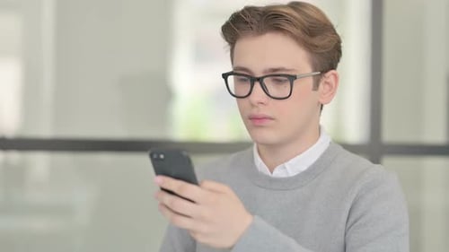 Young Man Using Smartphone