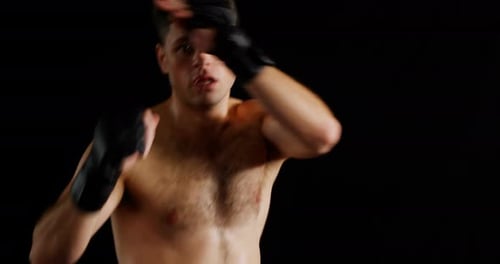 Man Practices Mixed Martial Arts Moves