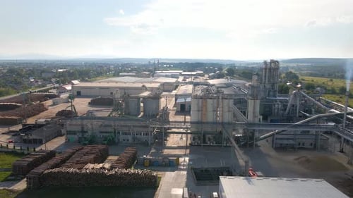 Aerial View of Wood Processing Factory with Stacks of Lumber at Plant Manufacturing Yard