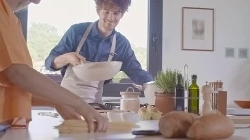 Man Cooking and Tossing Saute Pasta Spaghetti in Pan