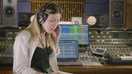 Young Caucasian Woman Working at Music Recording Studio