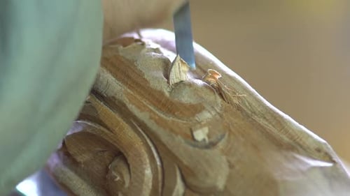 Man Fine Tuning Carved Wood Ornament