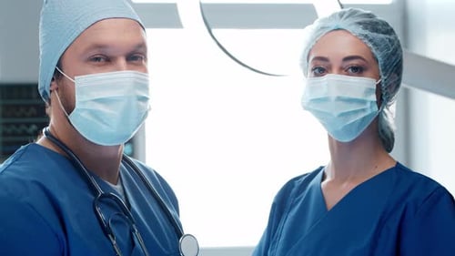 Two Healthcare Workers in Scrubs Posing