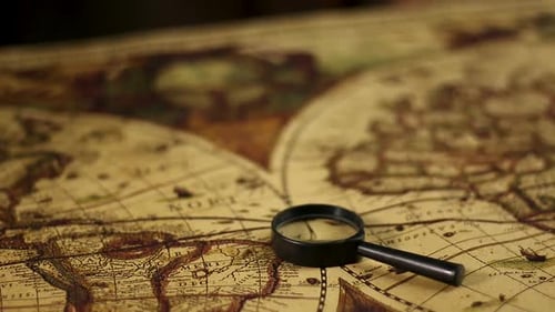 Antique Map and Magnifying Glass Exploration