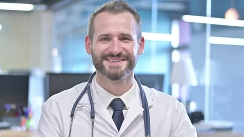 Portrait of Cheerful Young Doctor Smiling at Camera
