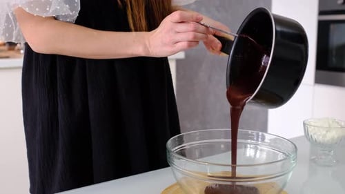 Chocolate Being Poured into Bowl for Delicious Recipe