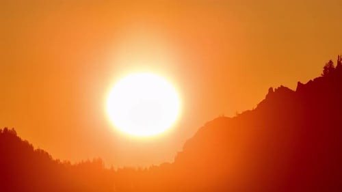 Golden Sunset Over Mountain and Trees