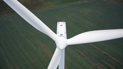 Close-up Aerial Shot of Large Windmill Turbine with Spinning Red Blade Stripes, Renewable Eco Energy