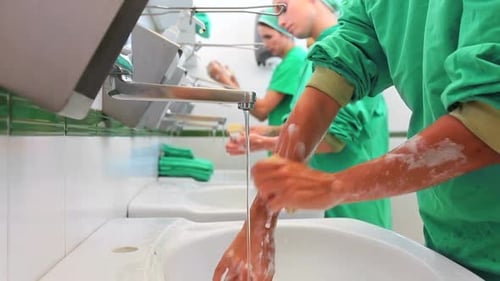 Hospital staff washing hands and forearms