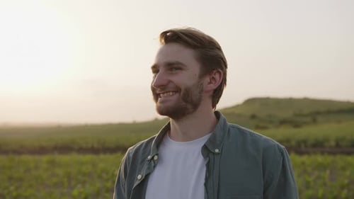 Close Up View of a Young Farmer on a Corn Field