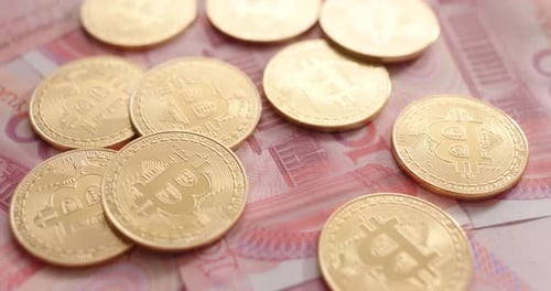 Bitcoins on Chinese Yuan Banknotes Currency