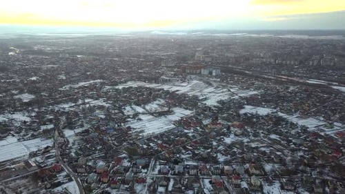 Aerial View of a Big Town or City at Sunset