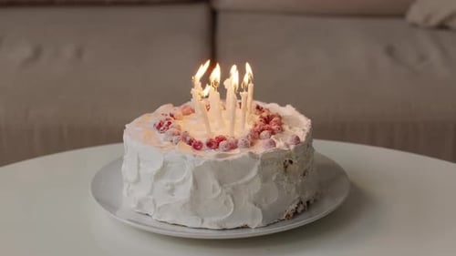 Festive Birthday Cake with Lit Candles