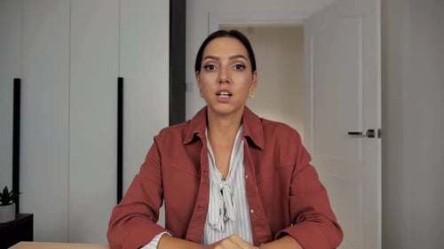 Woman Talking to Camera in Professional Setting