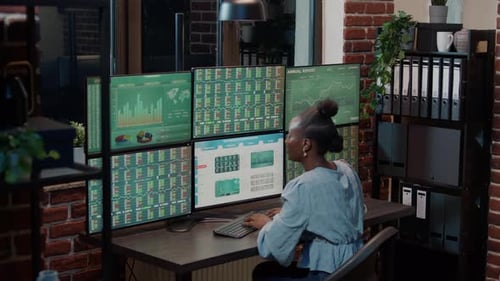Woman Celebrates Success in Financial Data Analysis
