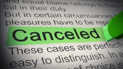 Green Highlighter Marks Canceled Word on Paper