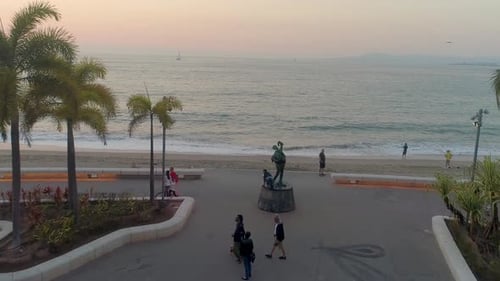 Coastal Promenade at Sunset with Tropical Palm Trees