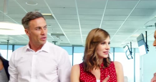 Business people giving a high five to each other in a modern office 4k