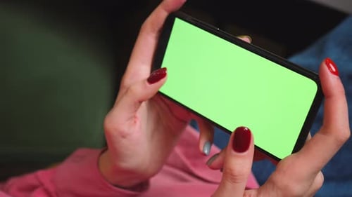 Close Up Woman Hands Holding Chromakey Green Screen Smartphone Watching Content Swiping Scrolling
