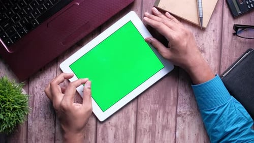 Top View of Businessman Using Digital Tablet with Green Screen