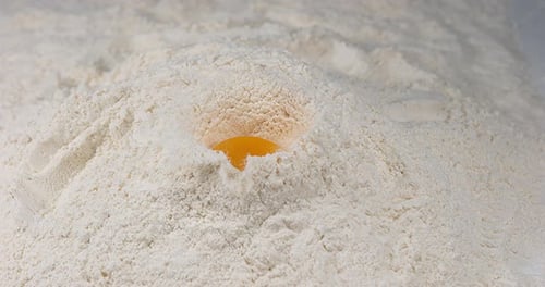 Egg Falling on Flour, Slow Motion 4K