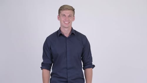 Smiling Young Adult in Blue Button-Down Shirt