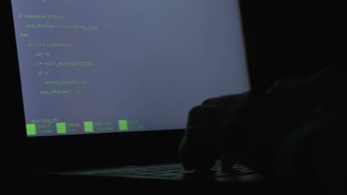 Close up Typing on Laptop Coding at Night