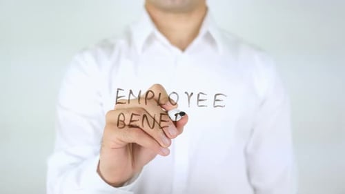 Writing Employee Benefit on Clear Surface