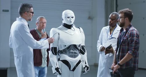 Scientists Examining a Humanoid Robot