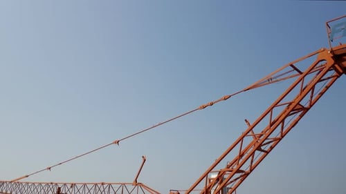 Tall Crane Standing Against Blue Sky
