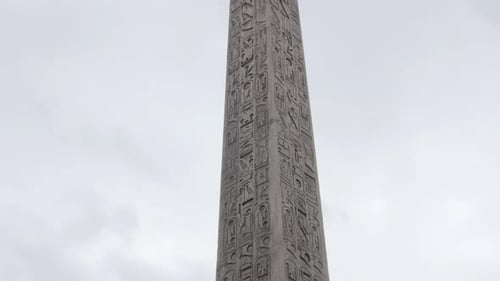 Granite Obelisk from Luxor on Concorde square in French capital Paris slow tilt 4K 2160p UltraHD foo