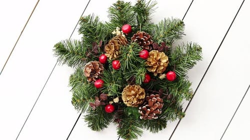Festive Christmas Wreath on White Wooden Background