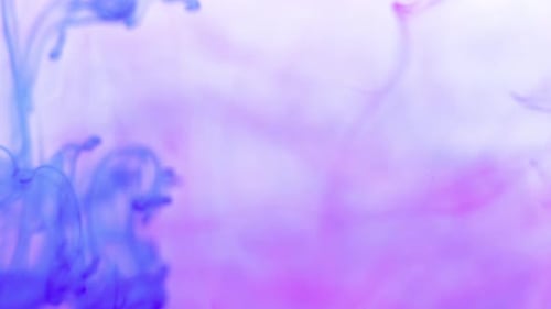 Blue Ink Swirling in Pink Abstract Background