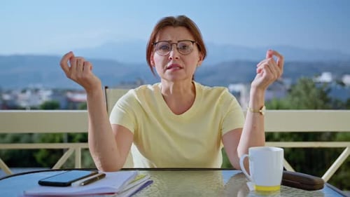 Portrait of Business Woman Looking at Webcam While Sitting at Home Office Desk