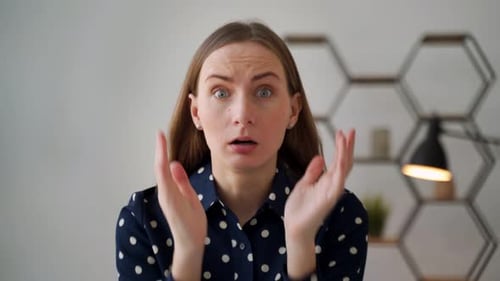 Surprised Woman Reacts with Shock and Fear