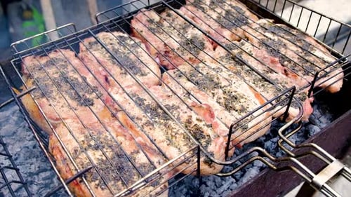 The Meat is Barbecued Over a Fire