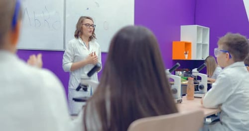 Teacher Teaches Children the Science in School