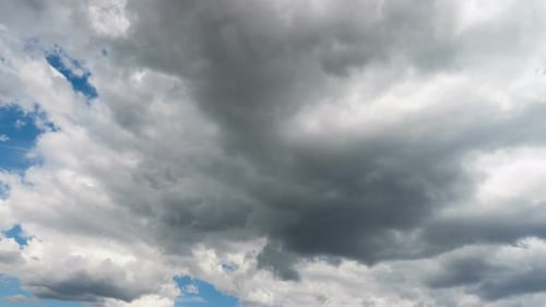 Dramatic Clouds Time Lapse Above Blue Sky