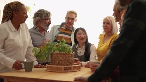 Friends Sharing Drinks and Conversation Indoors