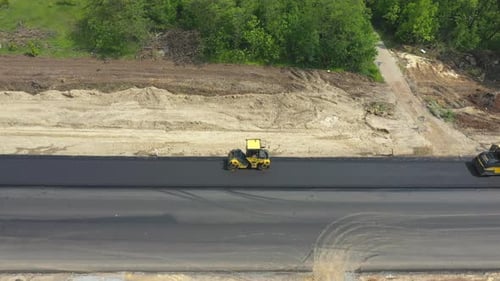 Aerial Shot of Rollers Laying New Asphalt Layer
