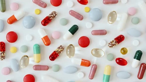 Assorted Colorful Medicine Pills and Capsules Overhead