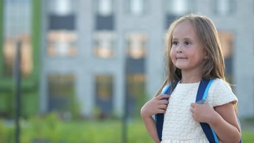 Shy Preschooler Girl Goes to School with Excited Expression