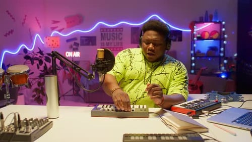 African American Songwriter Creating Music in Studio