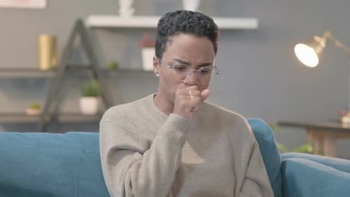 Woman Coughing at Home, Feeling Sick