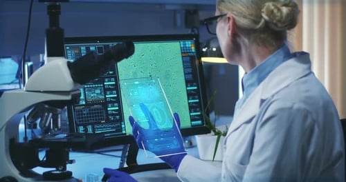 Scientist Using Holographic Display Screen