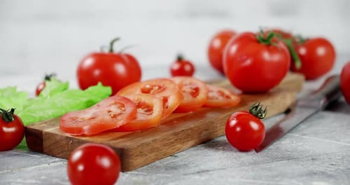 Tomatoes and Lettuce on Cutting Board
