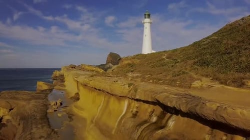 Coastal Cliffs With a Striking White Lighthouse