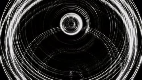 White rings of different size pulsating from a central point on black background